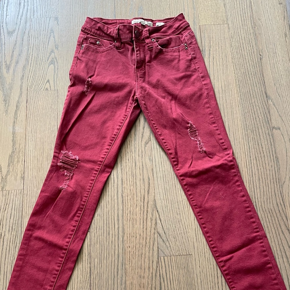 Size 3. Red jeans with rips